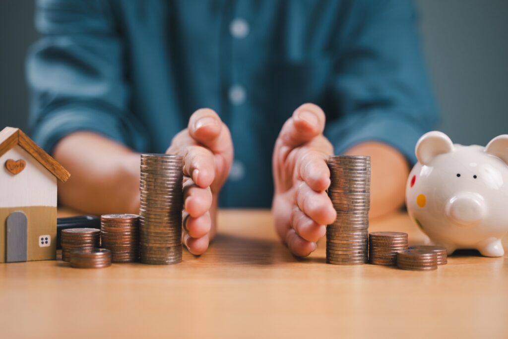 Man separate stack coin on table